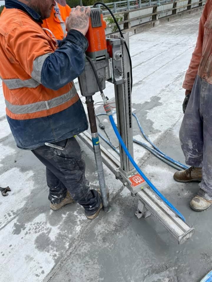 A man is using a machine to cut concrete — Newcastle Cut & Drill In Boolaroo, NSW