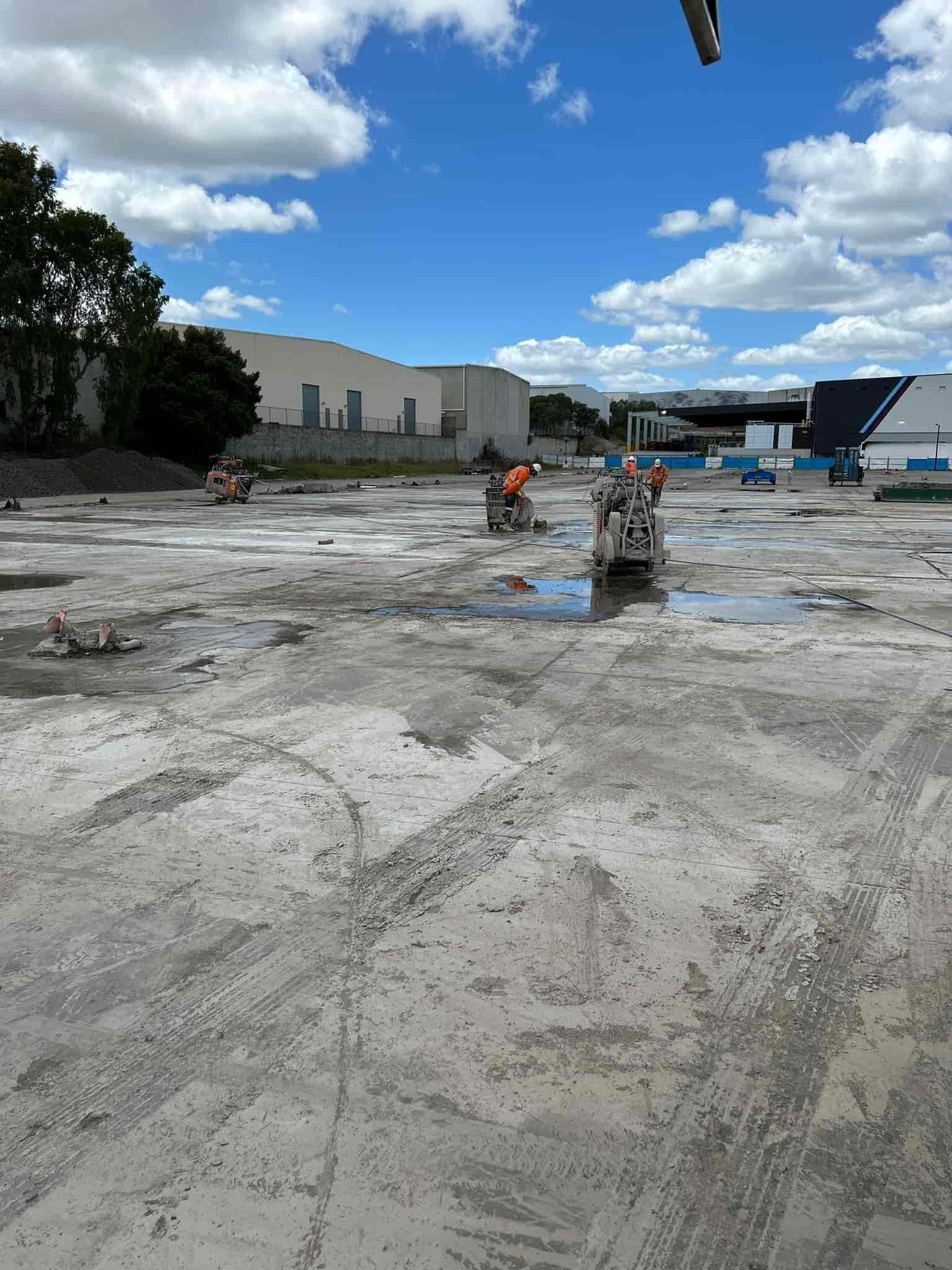 A concrete cutting machine is cutting concrete on a construction site — Newcastle Cut & Drill In Boolaroo, NSW