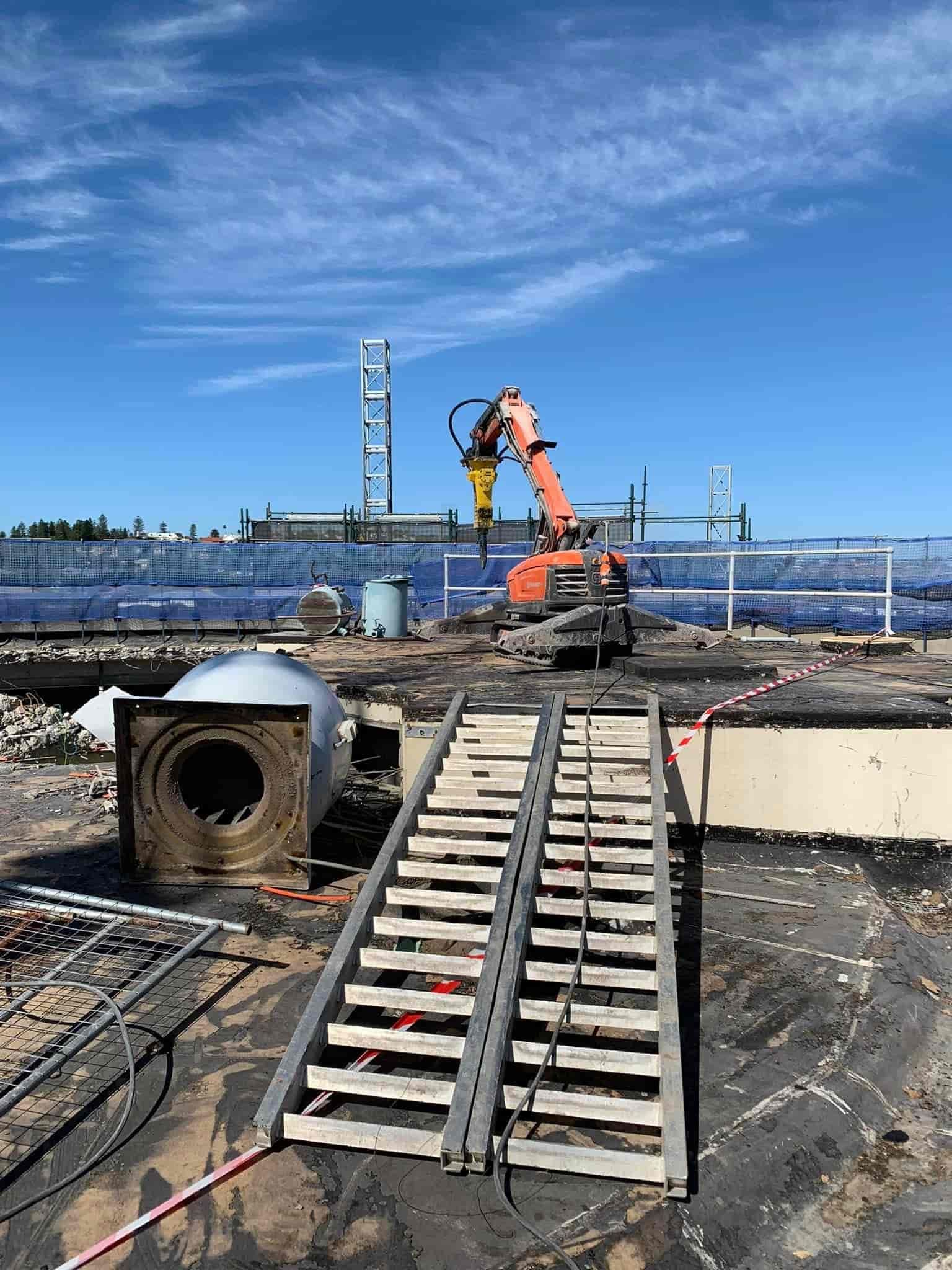 A construction site with a ramp and a crane in the background — Newcastle Cut & Drill In Boolaroo, NSW