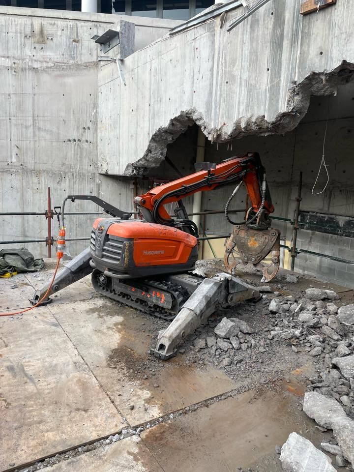 A robot is cutting a hole in a concrete wall. — Newcastle Cut & Drill In Boolaroo, NSW