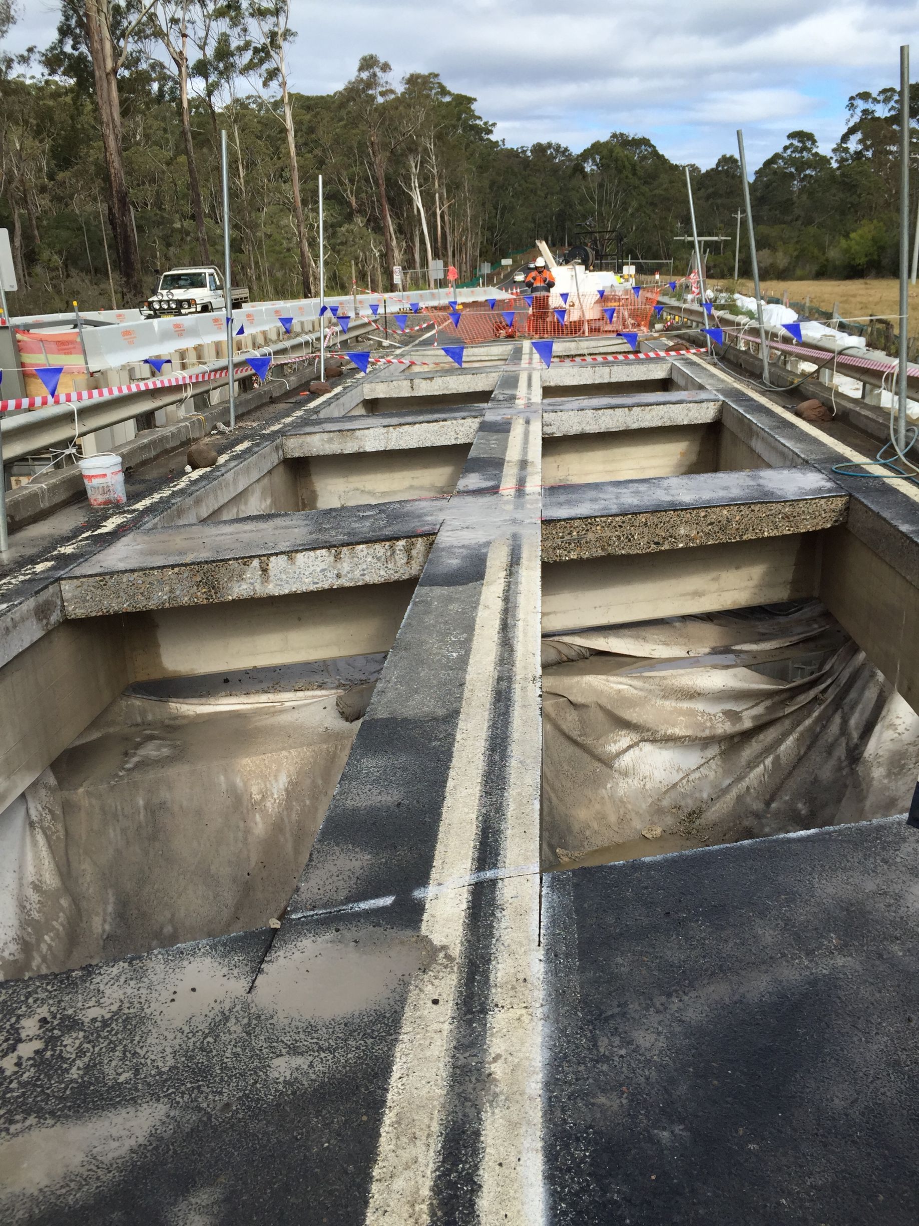 A Bulldozer Is Demolishing A Building With A Pile Of Bricks — Newcastle Cut & Drill In Boolaroo, NSW