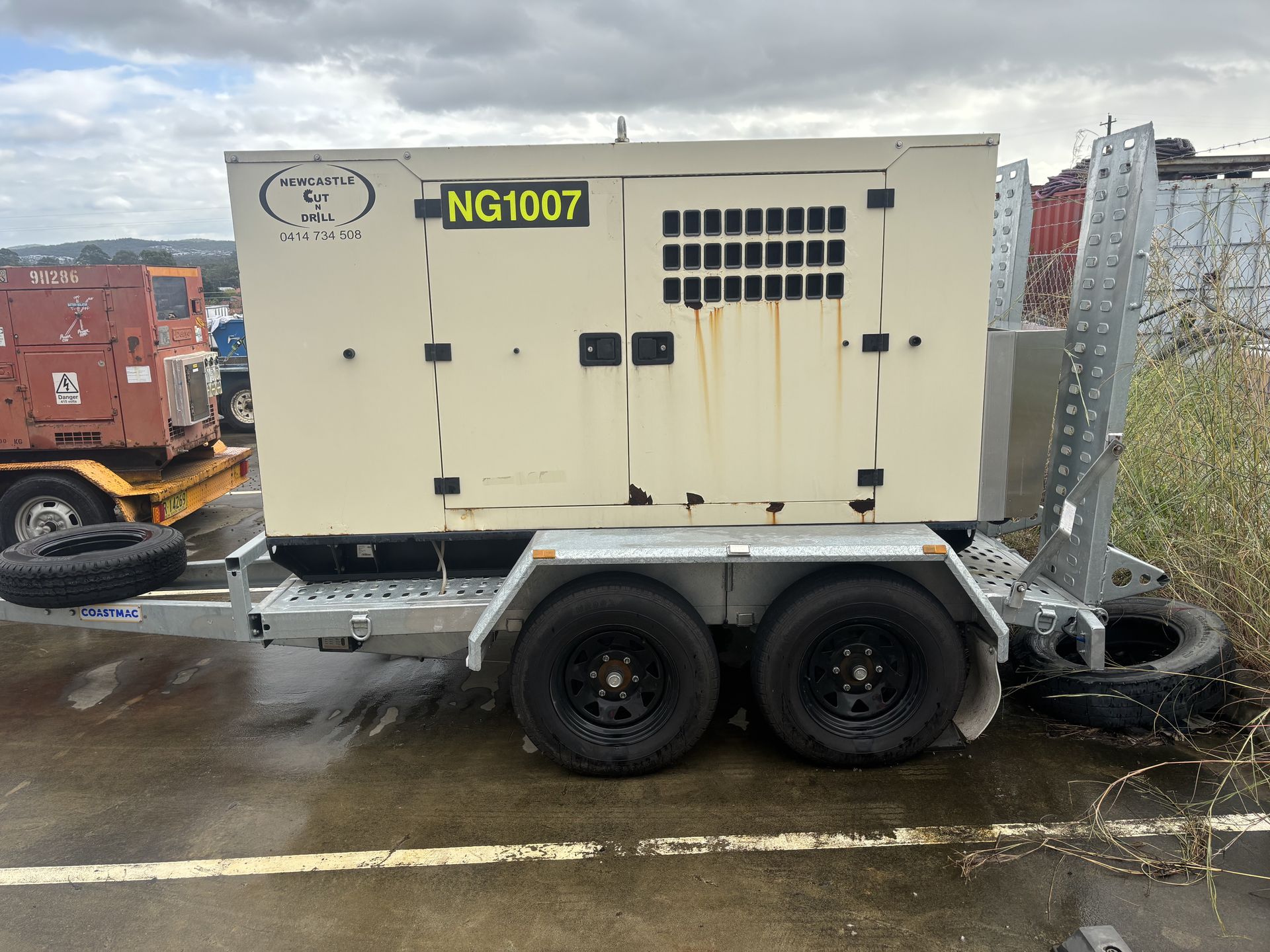 A cream mobile generator — Newcastle Cut & Drill In Boolaroo, NSW