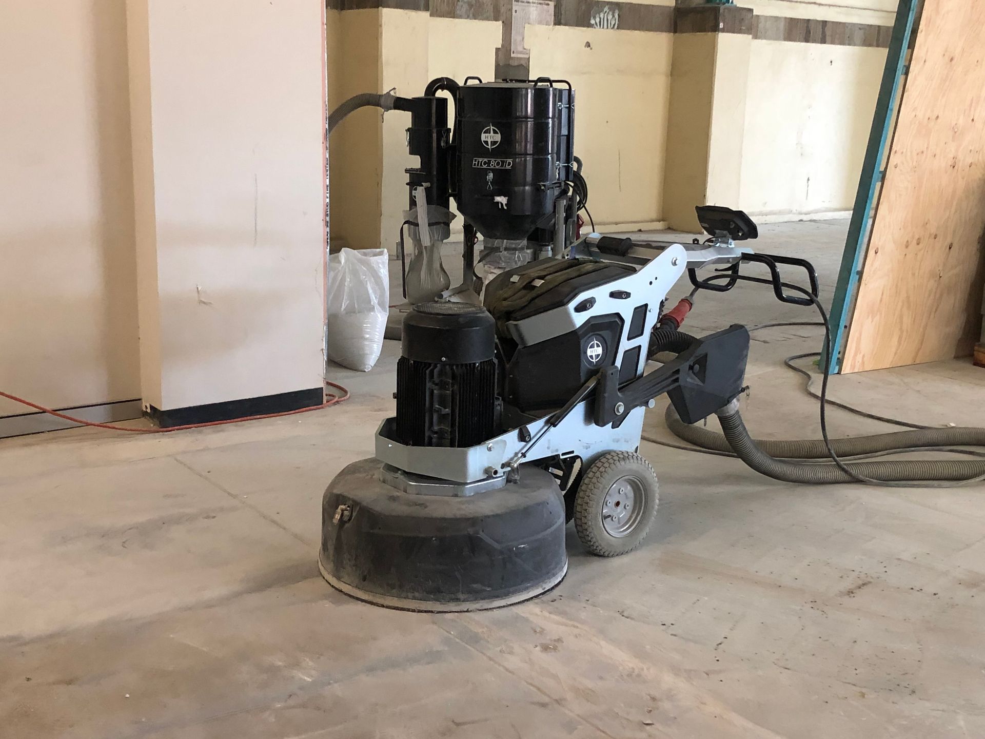 A grinding machine in the middle of a concrete floor — Newcastle Cut & Drill In Boolaroo, NSW