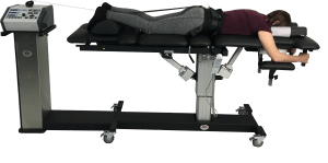 A person is laying on a table with a machine attached to it.
