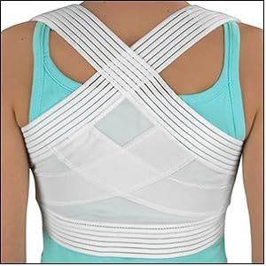 A woman is wearing a white posture corrector on her back.