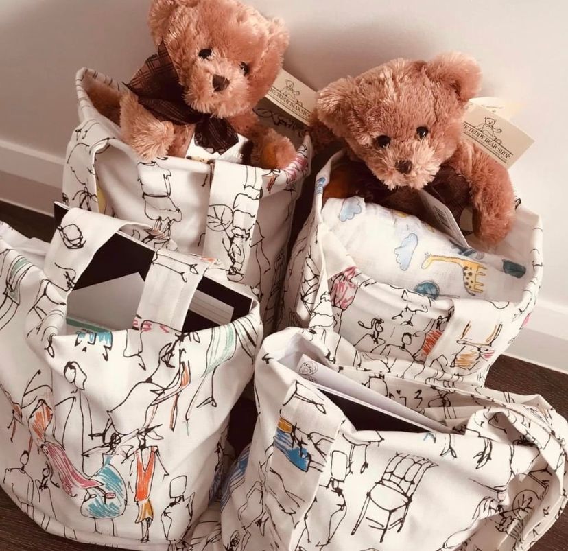 Two teddy bears placed inside patterned Escabags, representing the Escabags community initiative