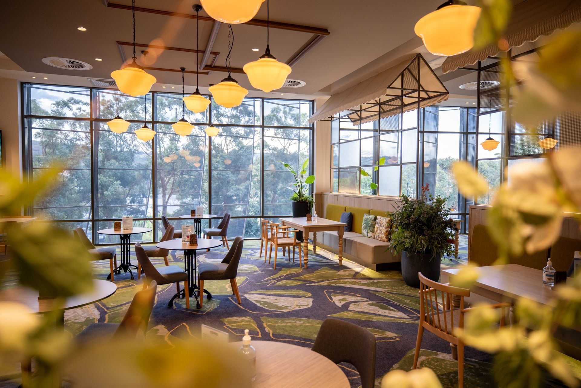 Interior of Glasshouse Grill showing dining tables and natural light