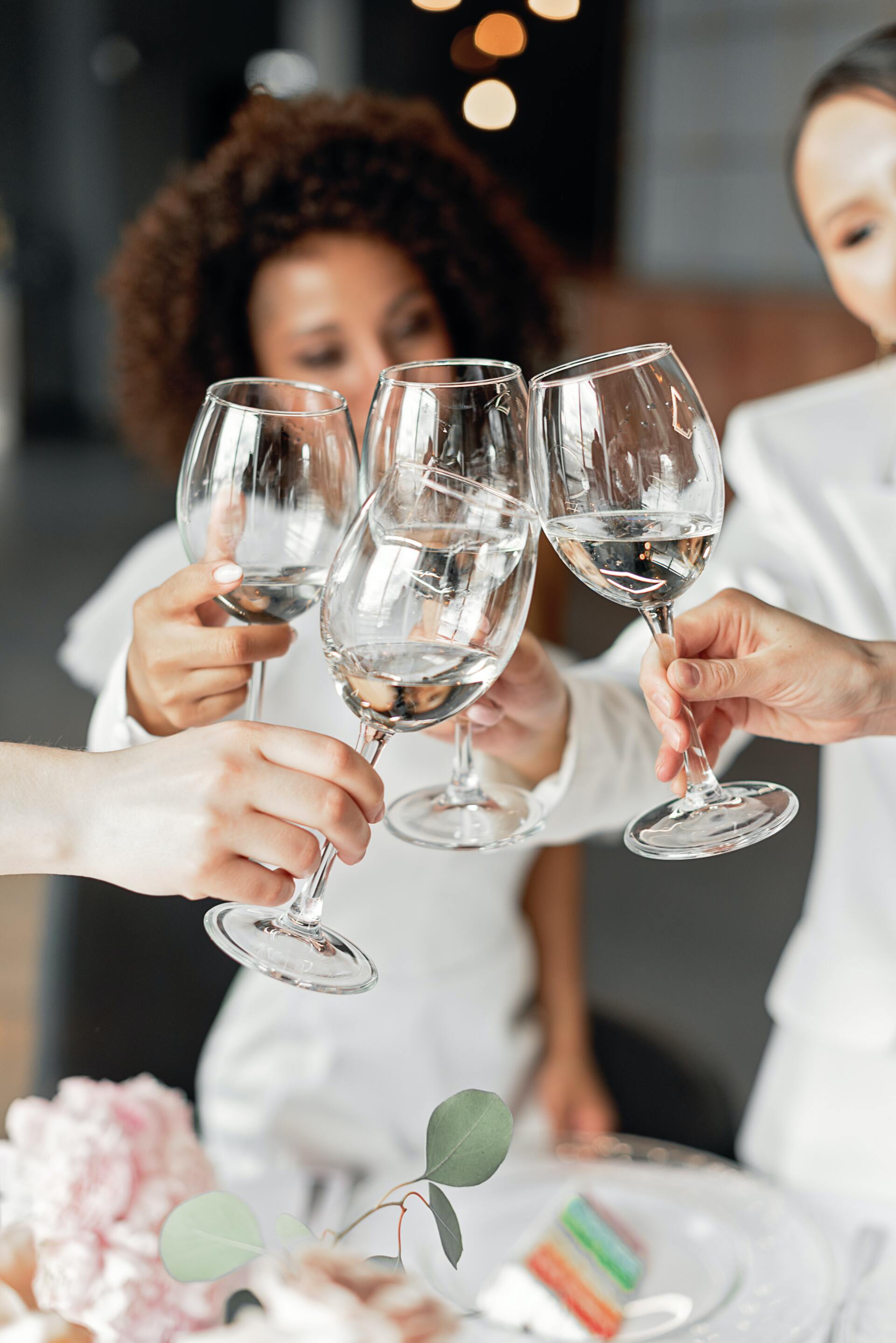 Guests raising wine glasses during a remembrance function at a Northern Beaches venue