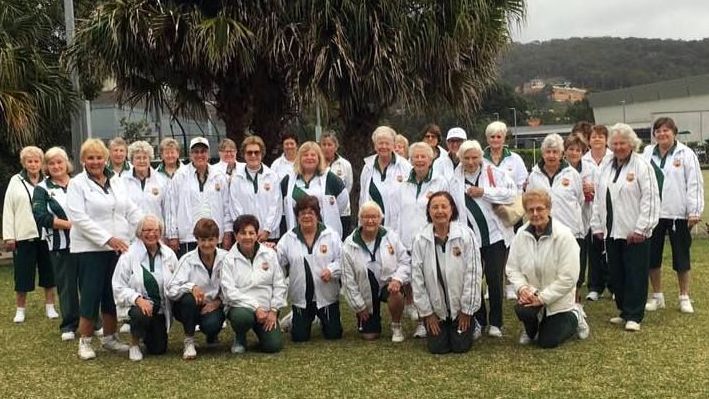Women’s lawn bowls team posing together outdoors at a Northern Beaches club