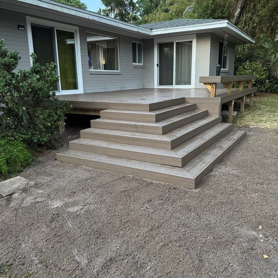 House porch with wide stepped deck and gravel yard in front