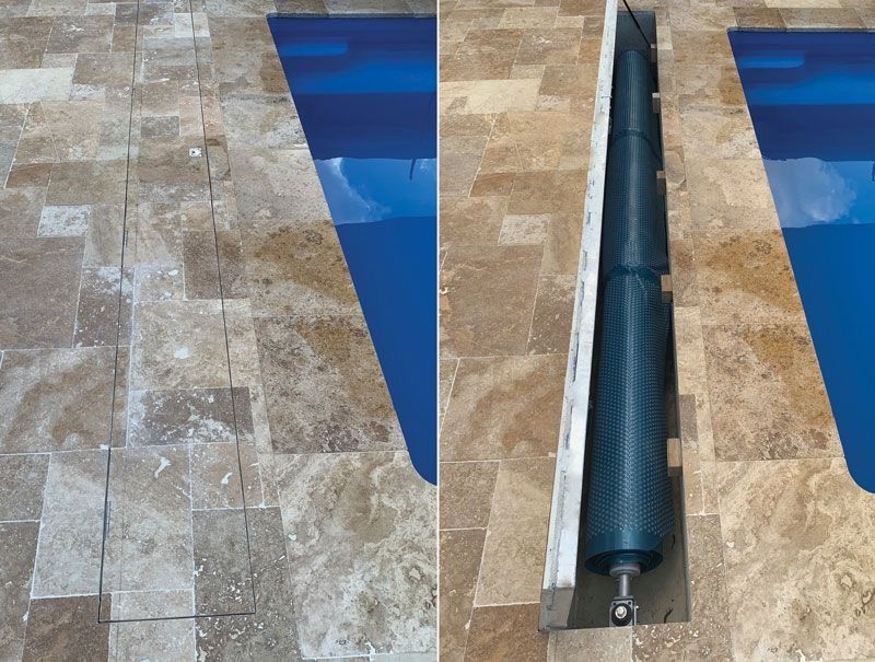 Poolside view: blue water, travertine tiles, and a partially covered pool with a rolled-up cover.