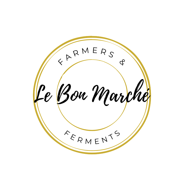 Le Bon Marché Farmers & Ferments logo in black and gold circular lettering