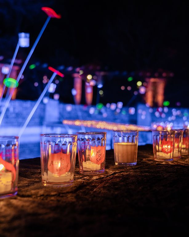 Lit lumignon candle on a Lyon windowsill during the Festival of Lights, symbolizing the city’s Decem
