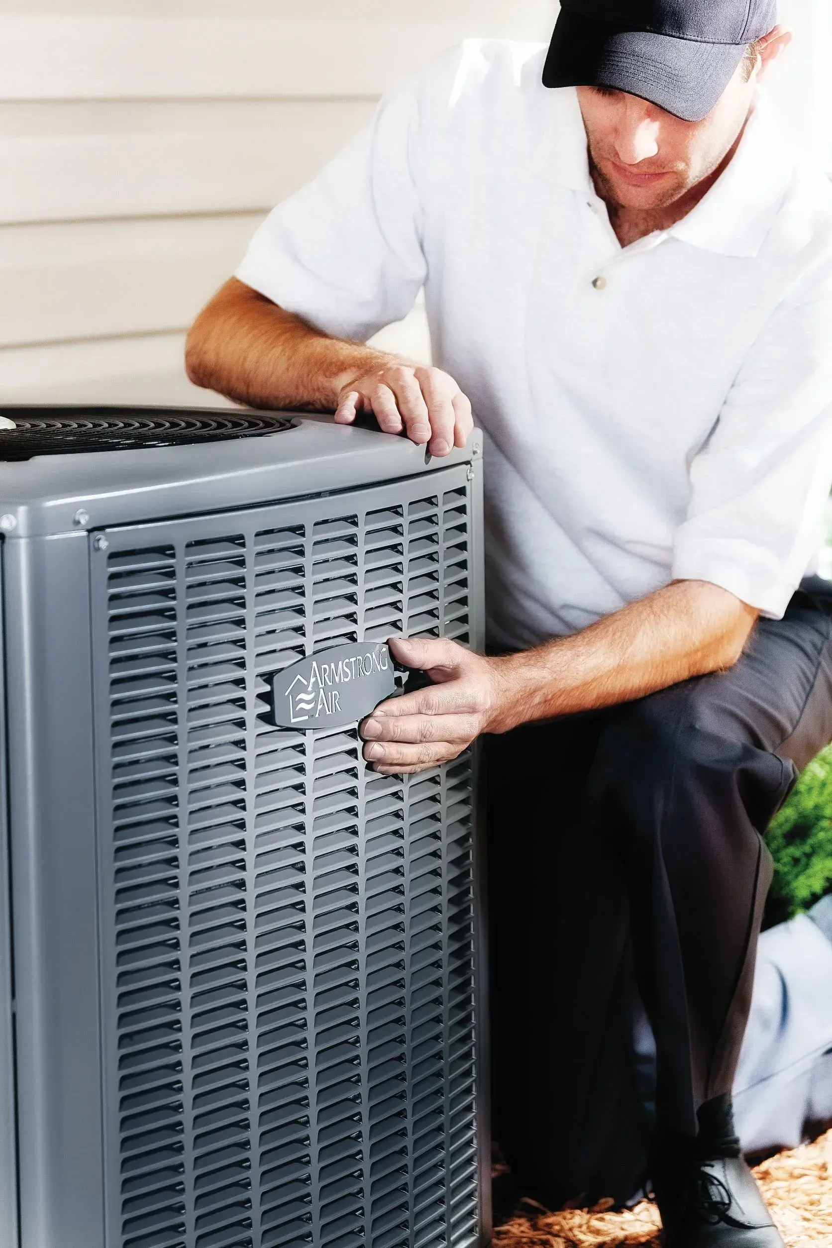 M&M Global technician servicing a furnace in Windsor, Ontario