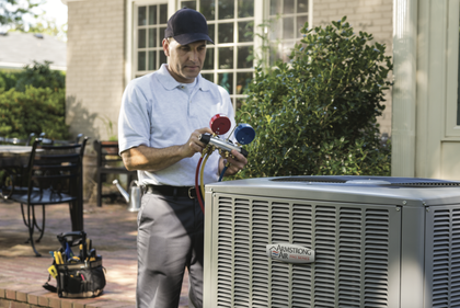 HVAC technician servicing a furnace in Windsor Ontario