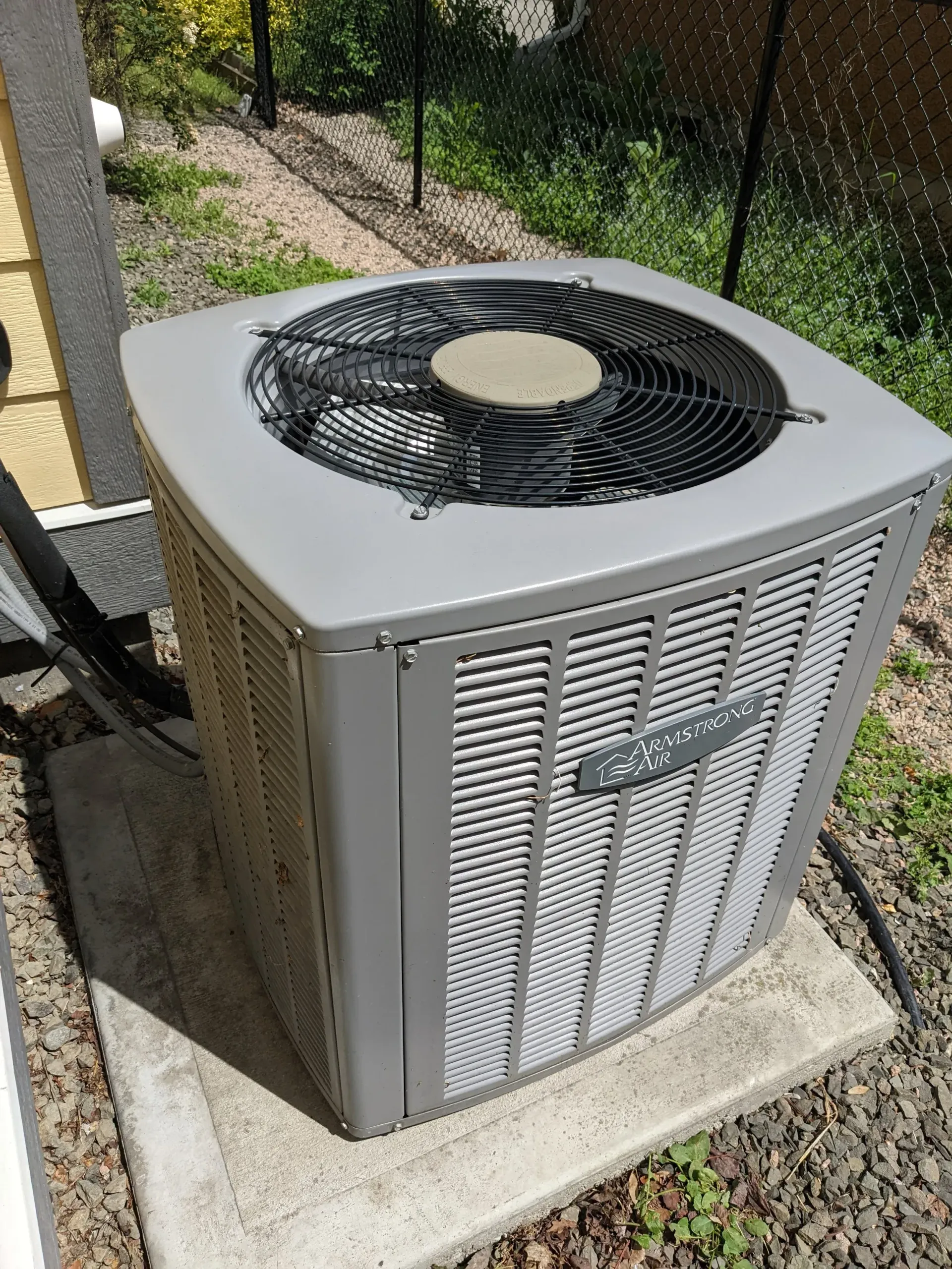 Residential air conditioning condenser installation in Essex County
