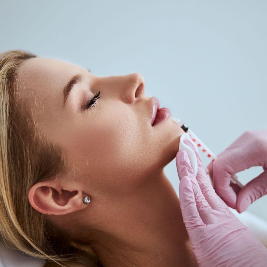 A physician placing lip filler with precision at MAX MD Medical Aesthetics in Garden City, NY
