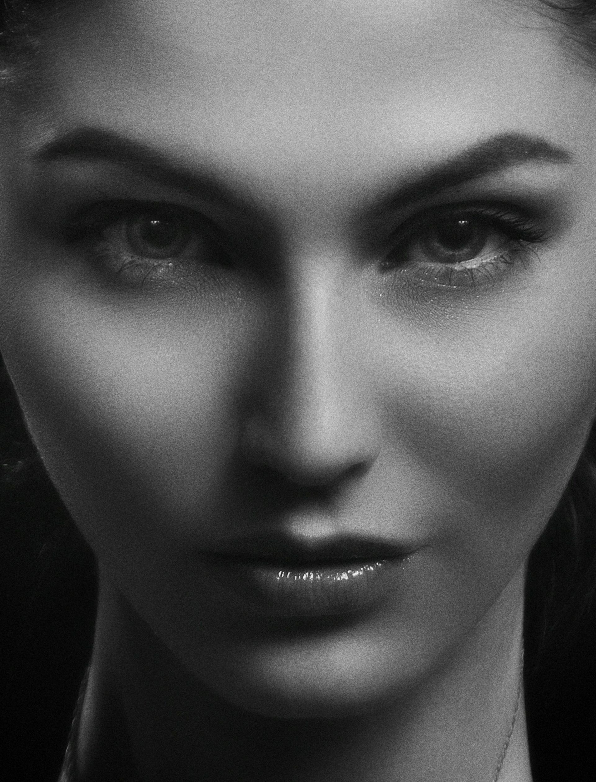 A black and white beauty portrait with sculpted light across the cheek and brow at MAX MD Medical Aesthetics and Wellness in Garden City, NY