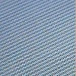Close-up of black, textured fabric with a repeating grid pattern.