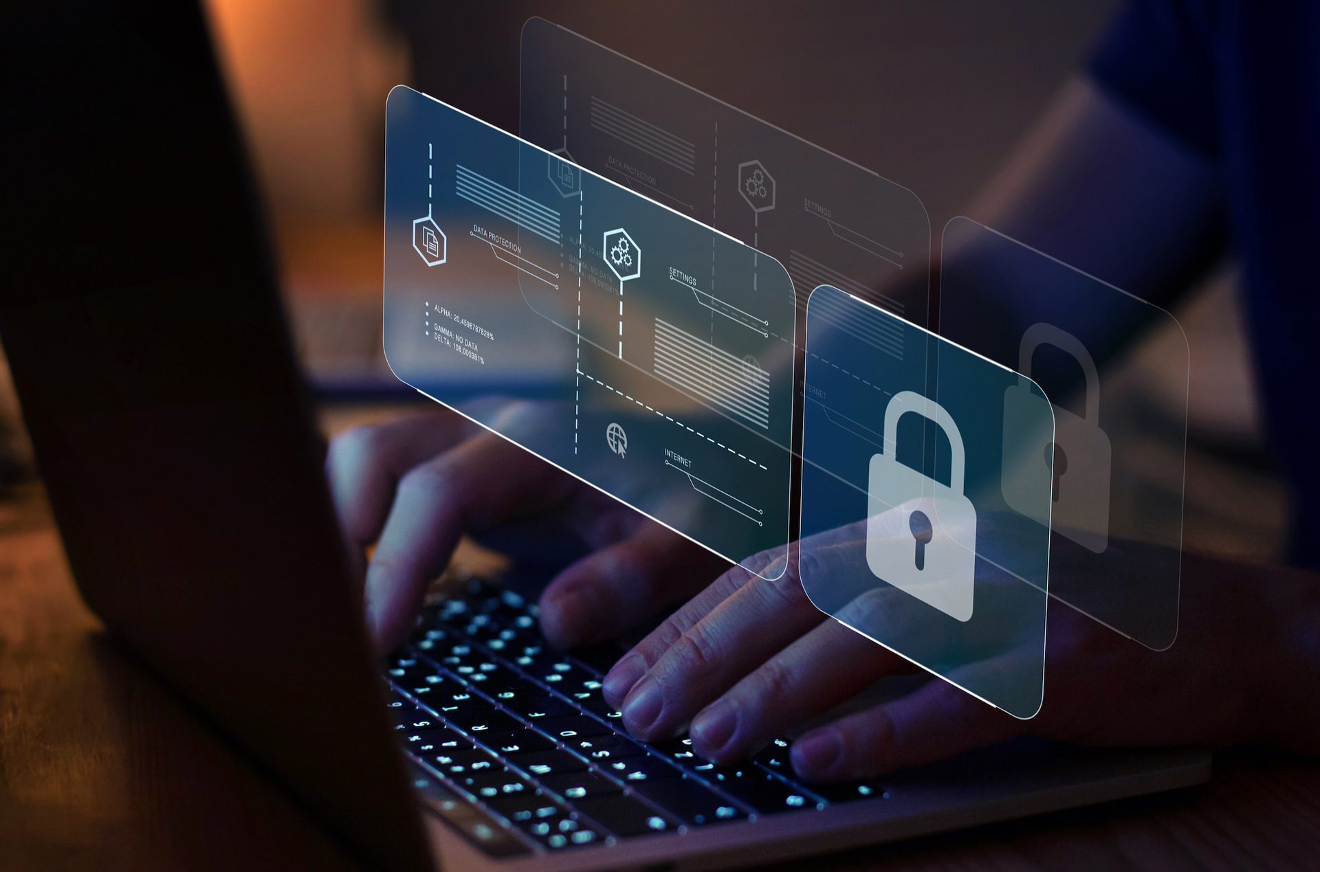 A person is typing on a laptop computer with a padlock on the screen.