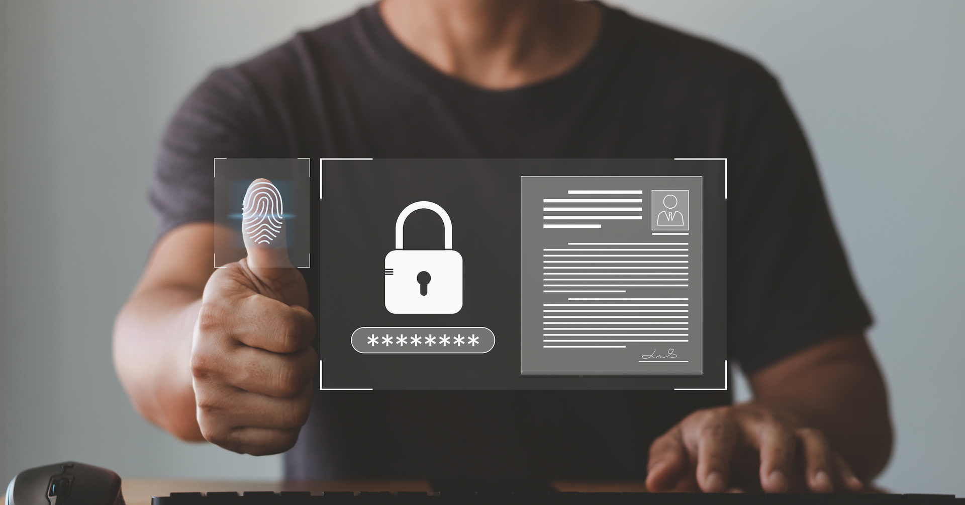 A man is giving a thumbs up while using a computer.