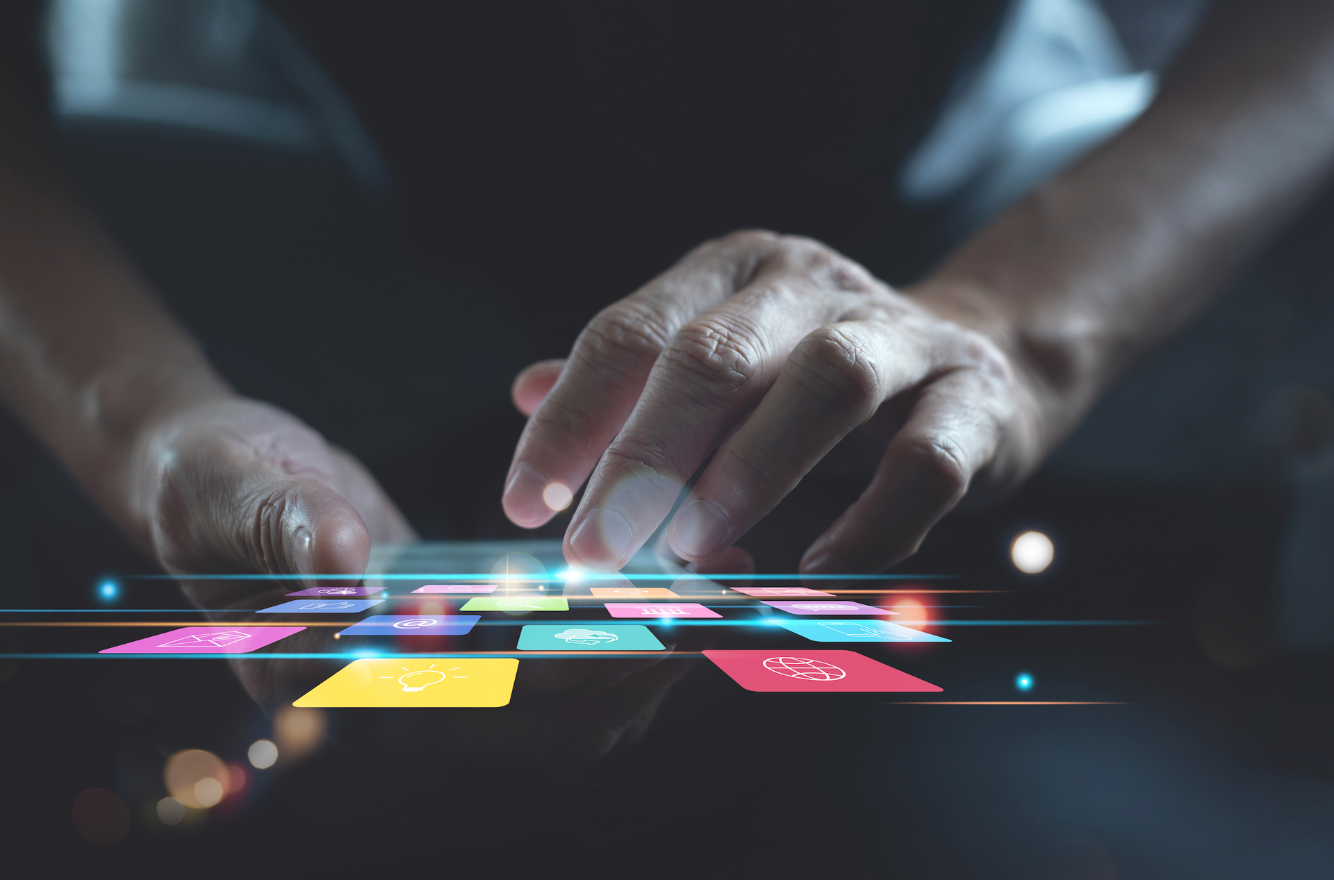 A close up of a person 's hands using a tablet computer.
