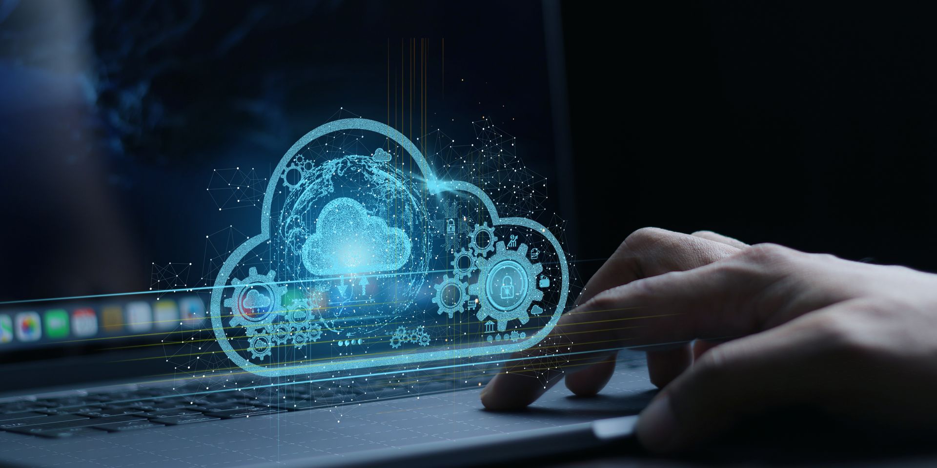 A person is typing on a laptop computer with a cloud coming out of the screen.