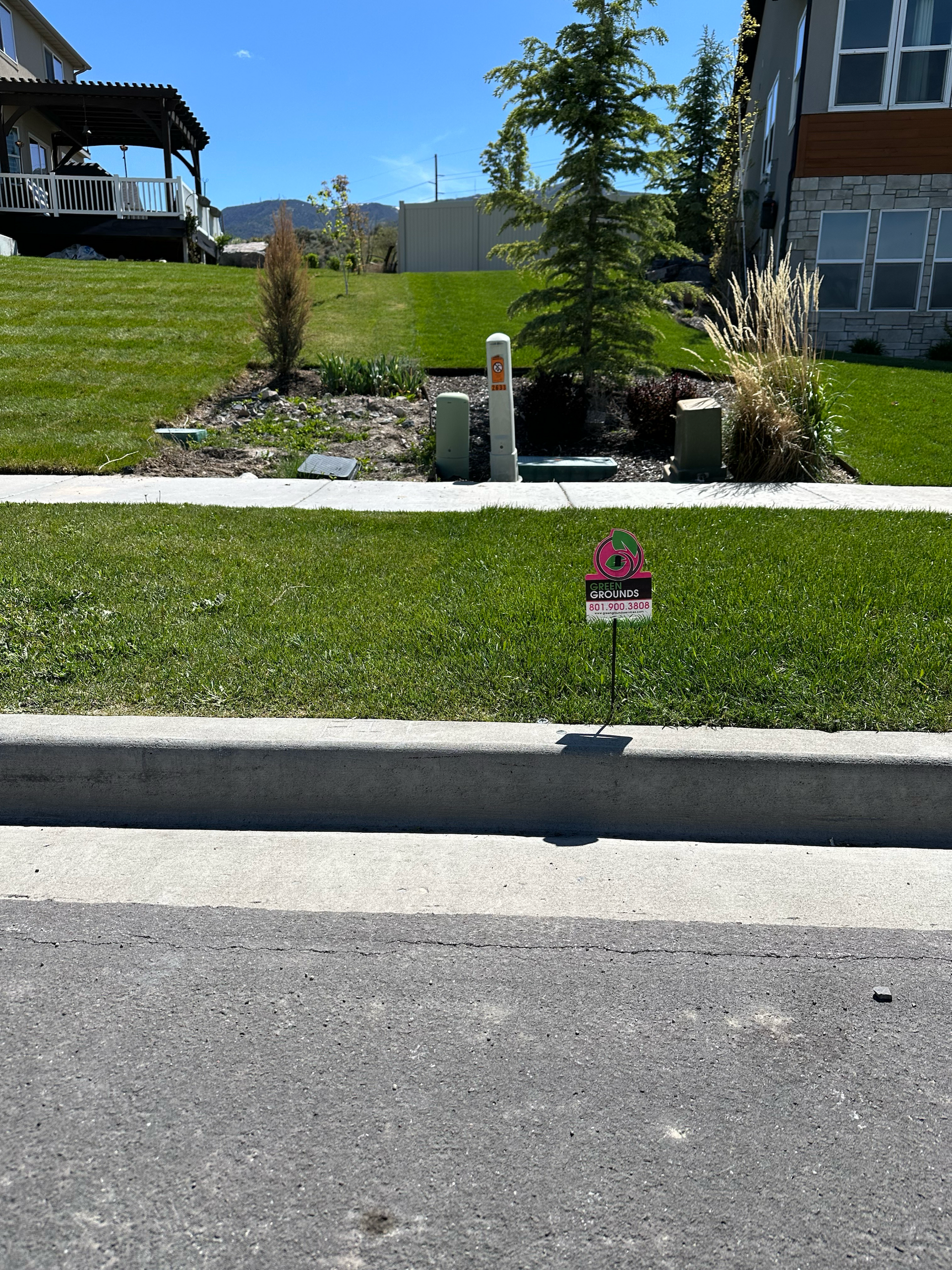A lawn with a sign that says ' i love you ' on it