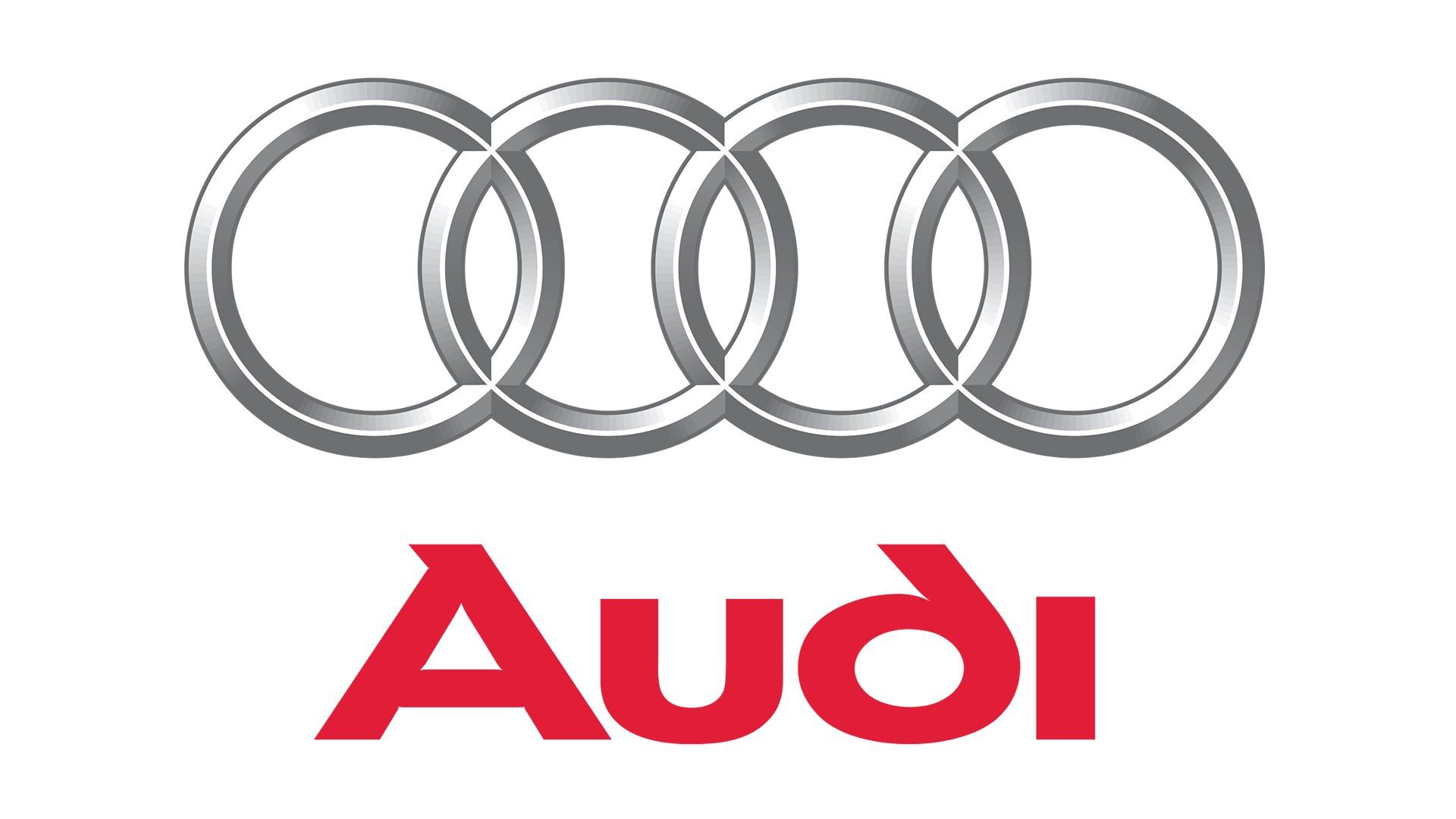 Audi logo with four silver rings above red “Audi” text on a white background