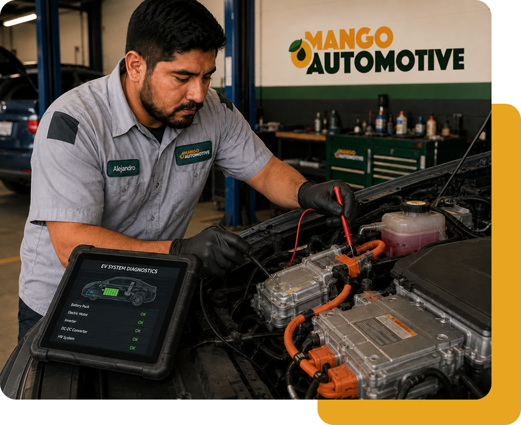 Mango Automotive technician running a computer diagnostic scan under the hood