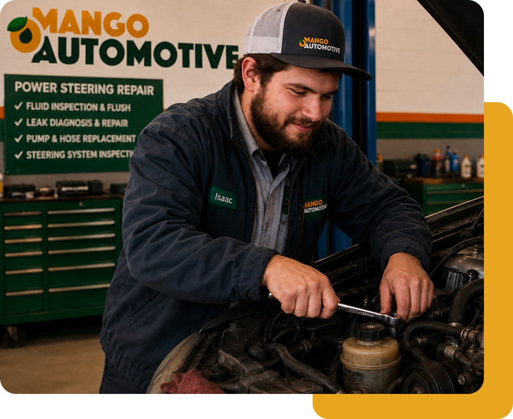 Mechanic working on a vehicle in a Mango Automotive shop, with a repair services sign in the background