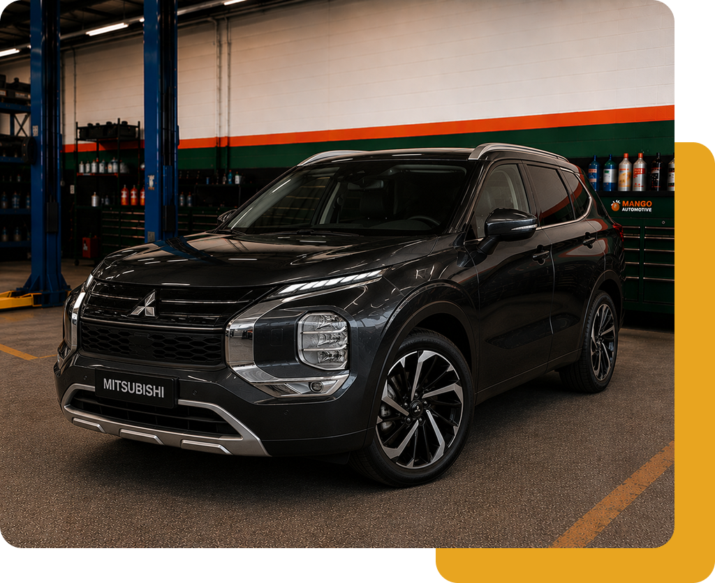Black SUV parked in an indoor garage with orange and green wall stripes