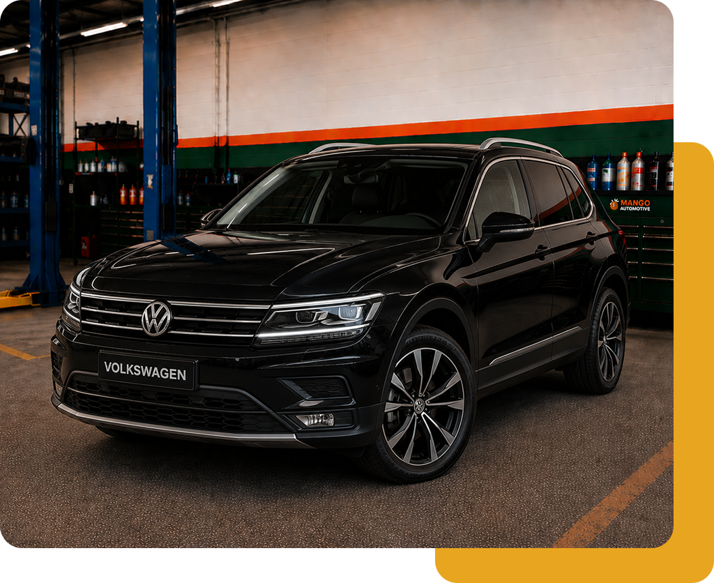 Black Volkswagen SUV parked indoors under industrial lighting