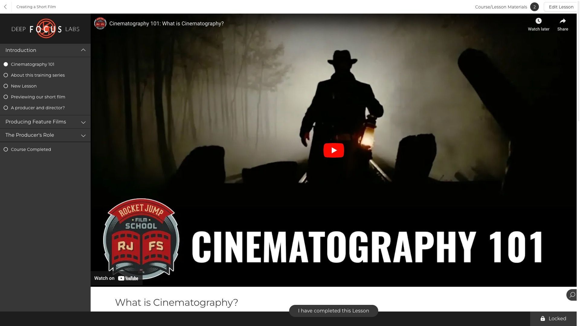 A computer screen shows a man riding a motorcycle in the dark.