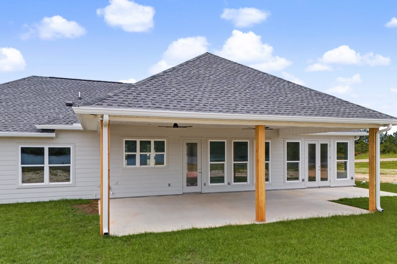 Covered back patio with wood columns on an RS Builders & Remodeling custom home