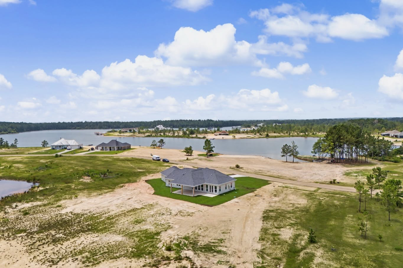 Aerial view of a completed Louisiana custom home in a waterfront community