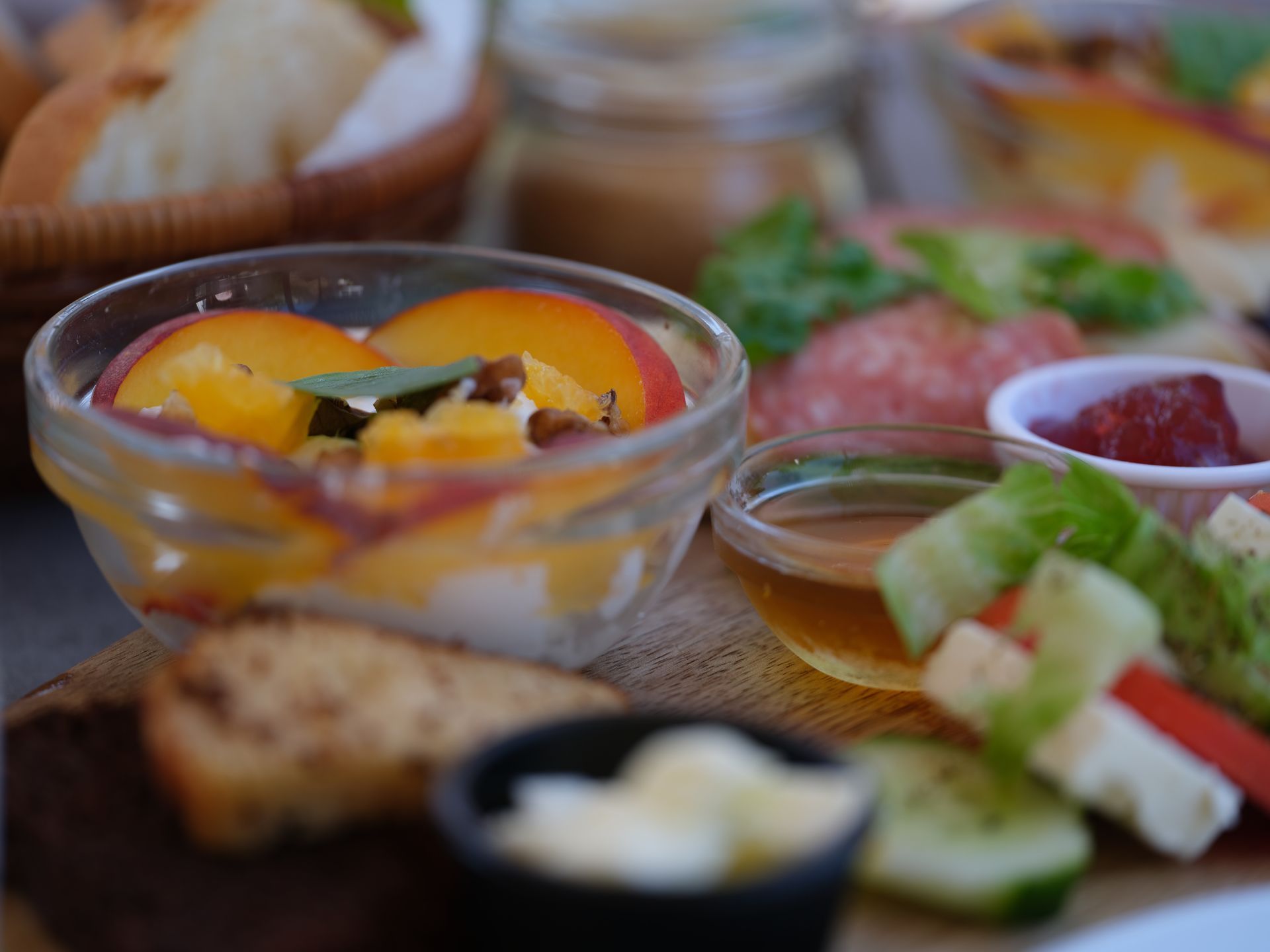 A close up of a bowl of fruit and vegetables on a table.