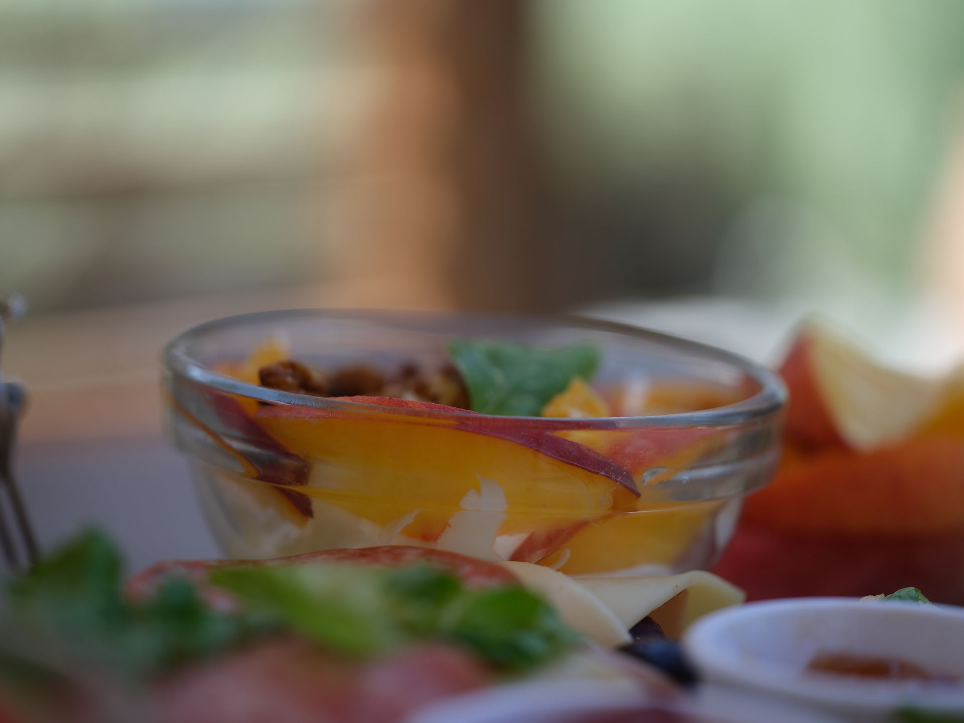 A close up of a bowl of fruit on a table