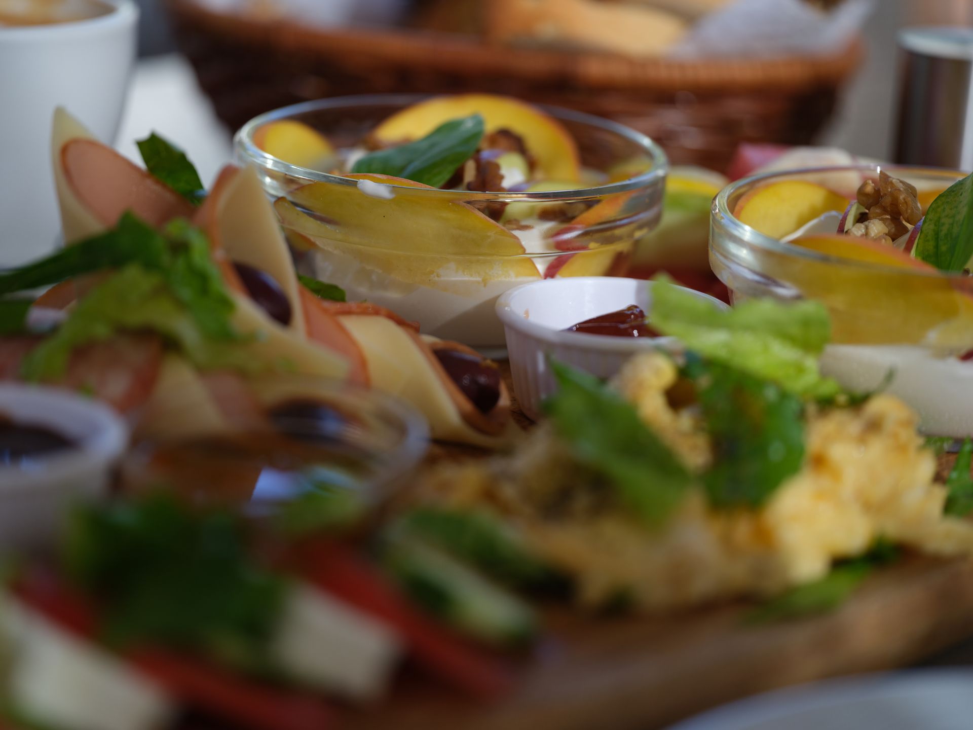 A close up of a plate of food with a basket in the background