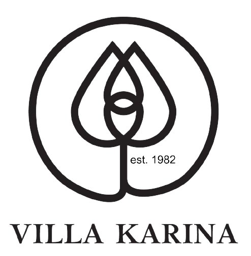 A black and white logo for villa karina with a rose in a circle.
