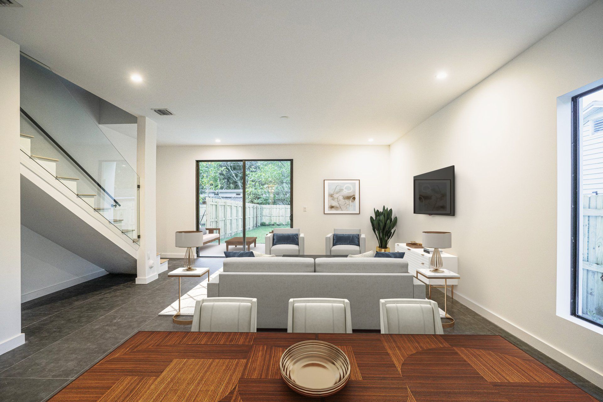 there is a dining table in the middle of the living room .