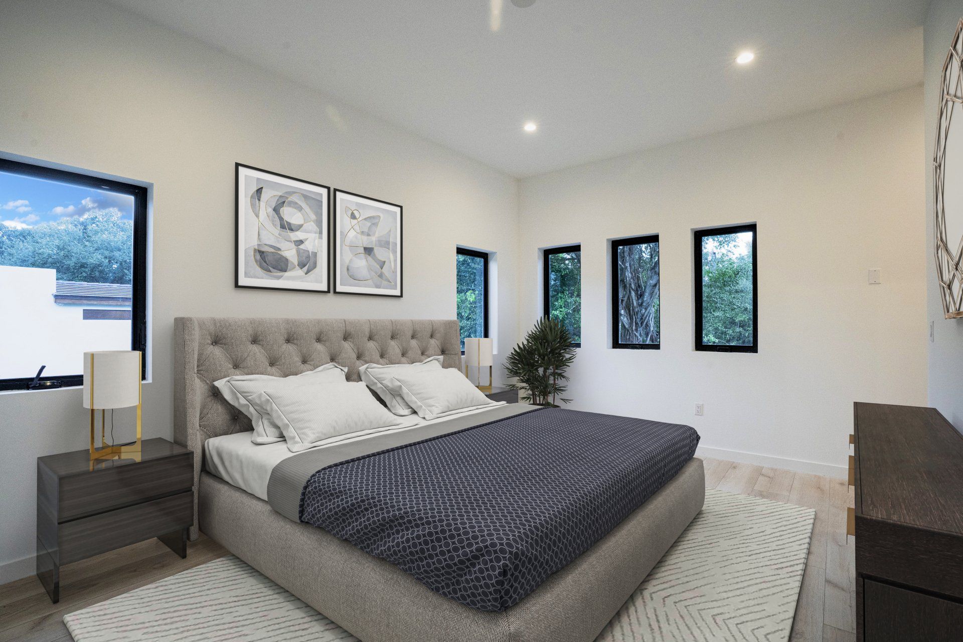 a bedroom with a large bed , dresser , nightstand and windows .