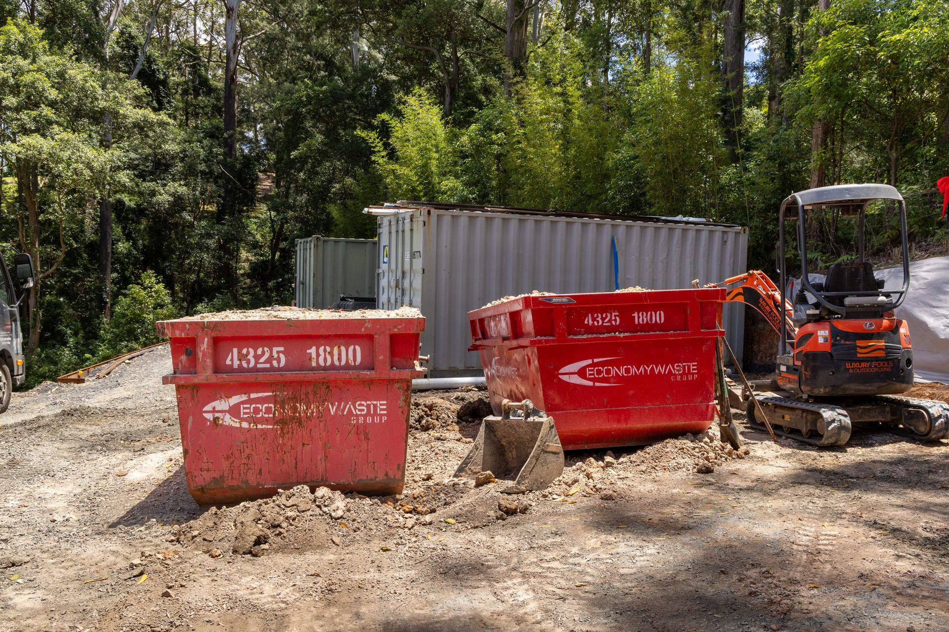 Red Dumpster Filled With Debris — Economy Waste Group | Skip Bins Central Coast In West Gosford, NSW