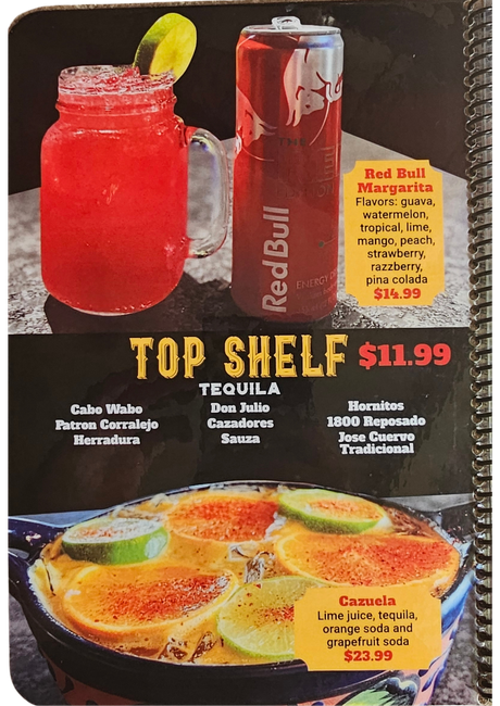 Menu ad showing colorful cocktails: a red frozen drink of a Red Bull margarita, and a fruit topped bowl drink.