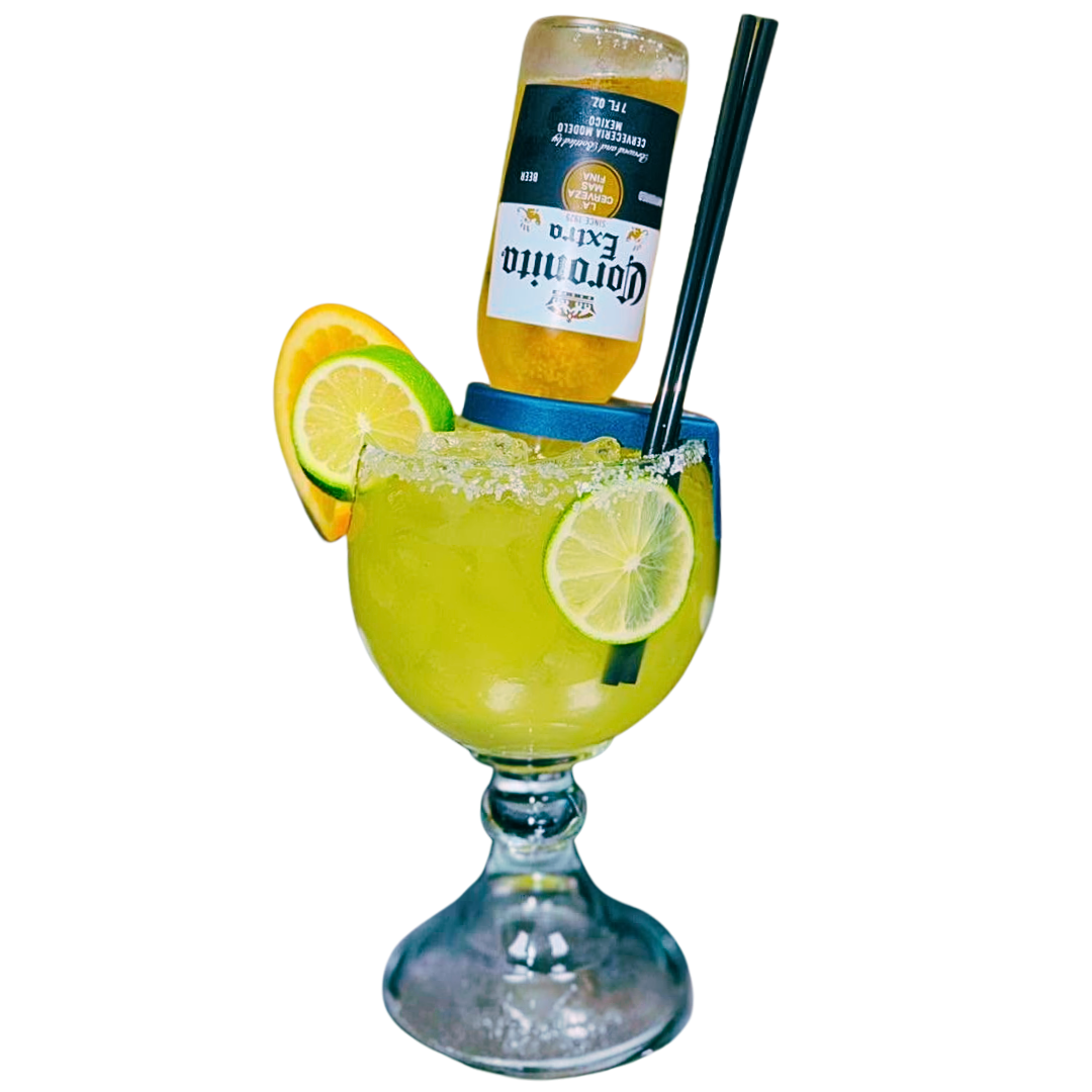 Margarita cocktail with a Corona bottle, lime, and orange slices.