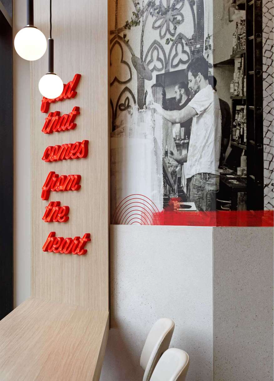 A wall with a picture of a man and a sign that says