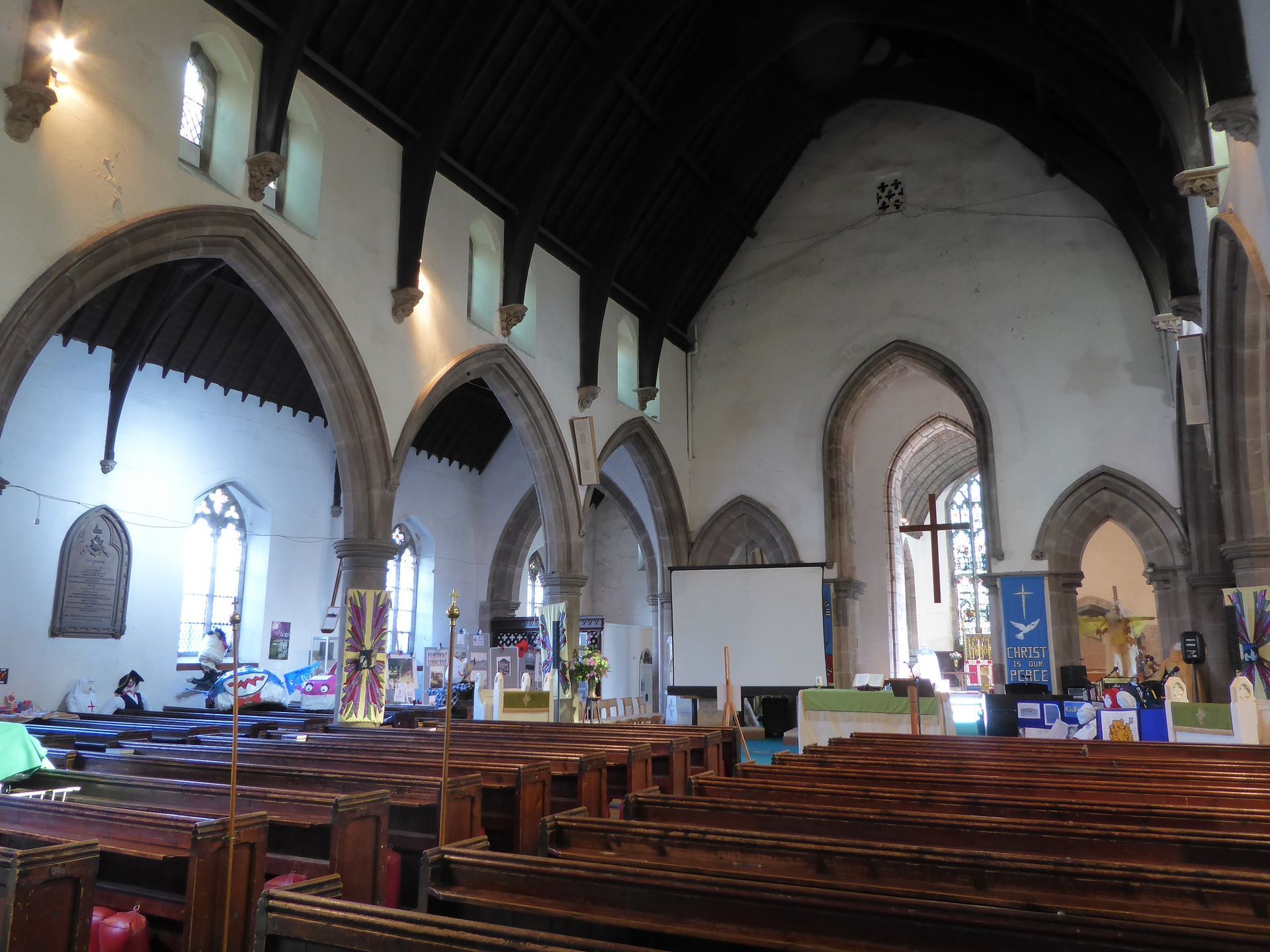 The inside of a church with rows of wooden benches st mary's atherstone warwickshire