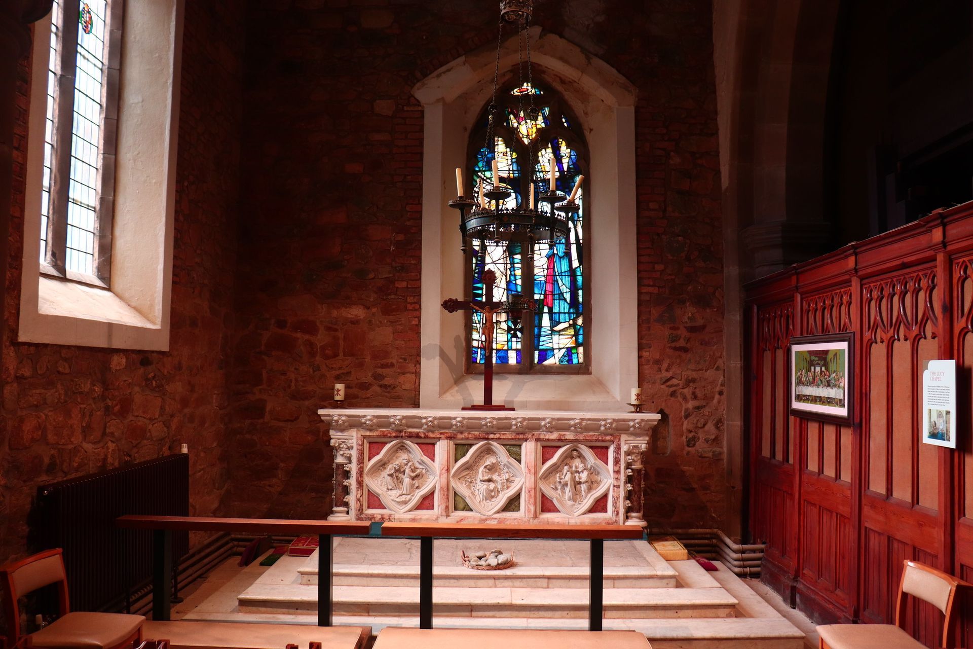 A church with a stained glass window and altar st mary's atherstone warwickshire