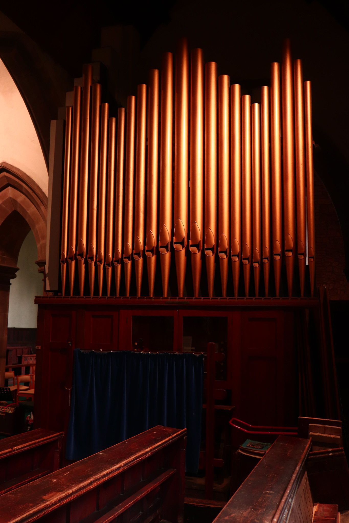 There is a large organ in the middle of the church.