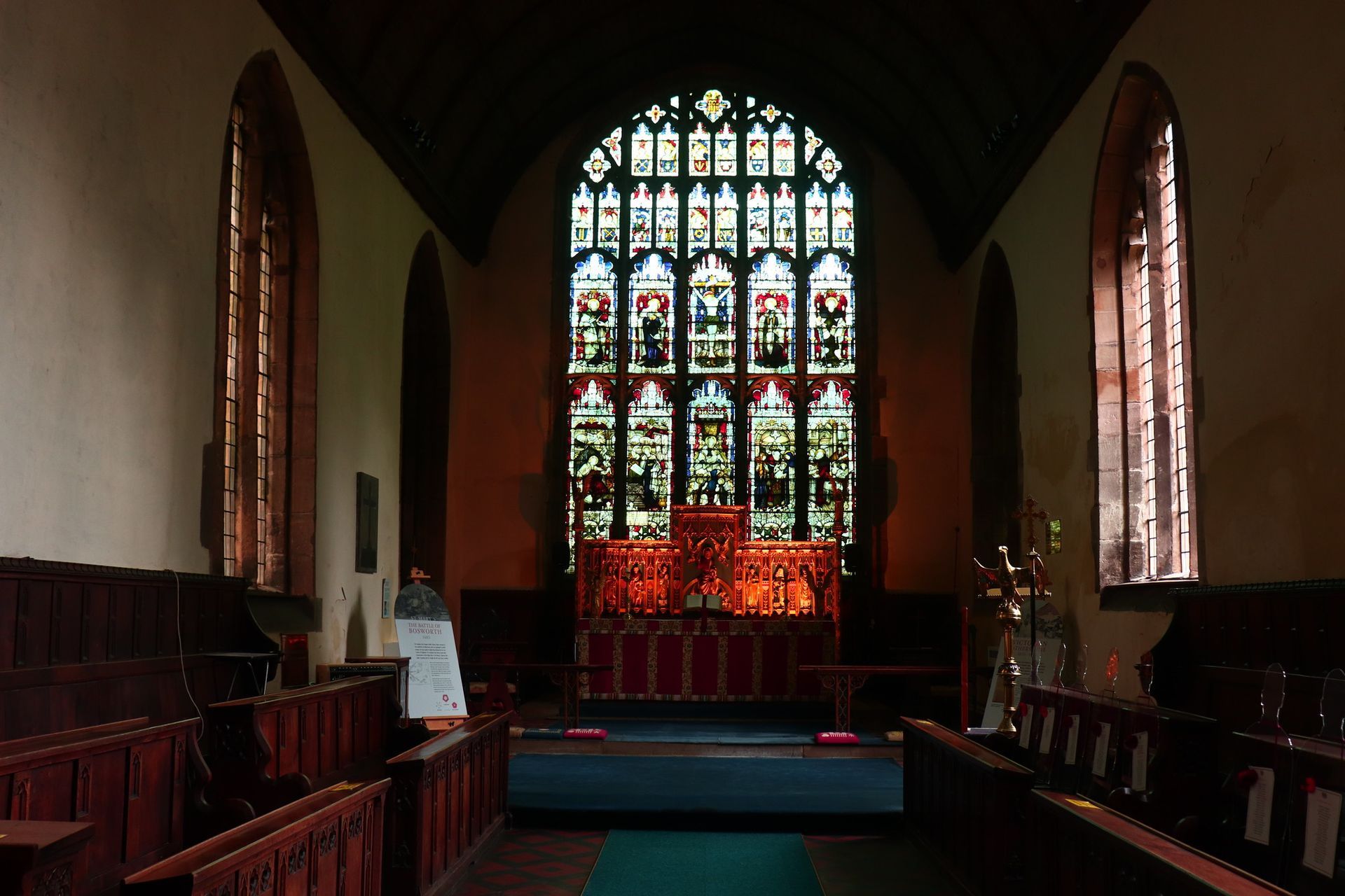 The inside of a church with stained glass windows st mary's atherstone warwickshire